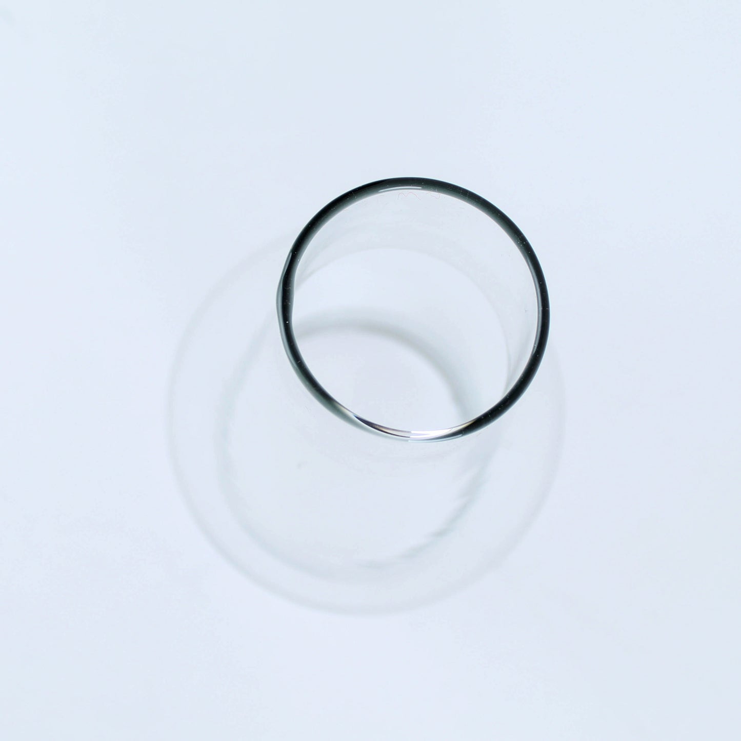 Clear cylindrical glass chimney with smooth rim designed for flame protection and light diffusion in home improvement projects