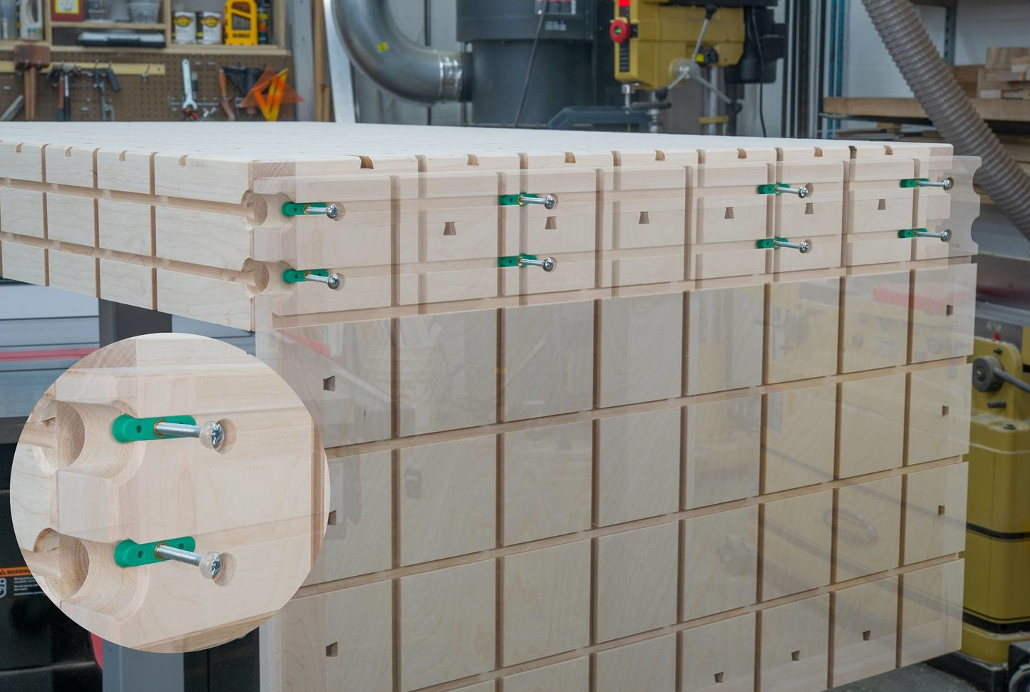 Wooden panel assembly with green dovetail hardware clamps used in woodworking, part of saw and power tool accessories collection