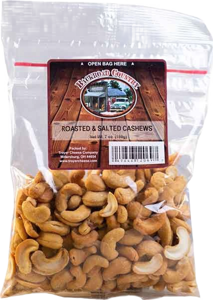 Clear bag of roasted and salted cashews with a rustic wooden label in snacks and food collection