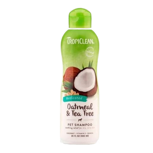 Green bottle of TropiClean medicated pet shampoo with oatmeal and tea tree ingredients for skin soothing care