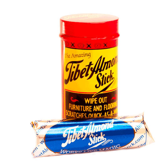 Yellow and red container with a blue-wrapped almond stick for furniture and flooring scratch repair in cleaning supplies collection