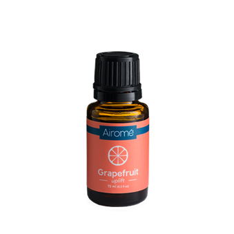 Amber glass bottle of grapefruit essential oil with black cap in home decor and under $50 collections