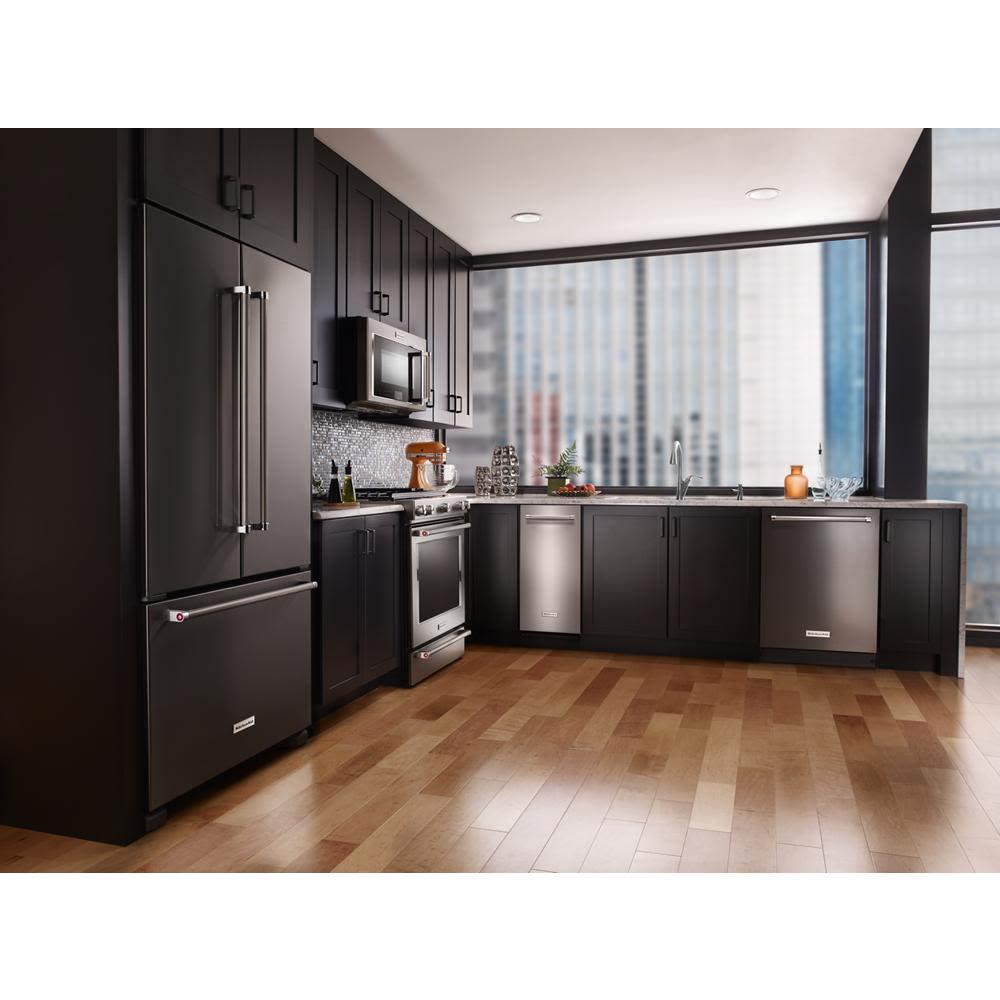 Built-in stainless steel trash compactor integrated into modern kitchen with black cabinetry in Kitchen & Kitchenware collections