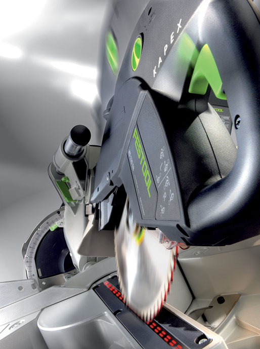 Close-up of Festool sliding compound miter saw cutting wood with precision in power tools and home improvement collections