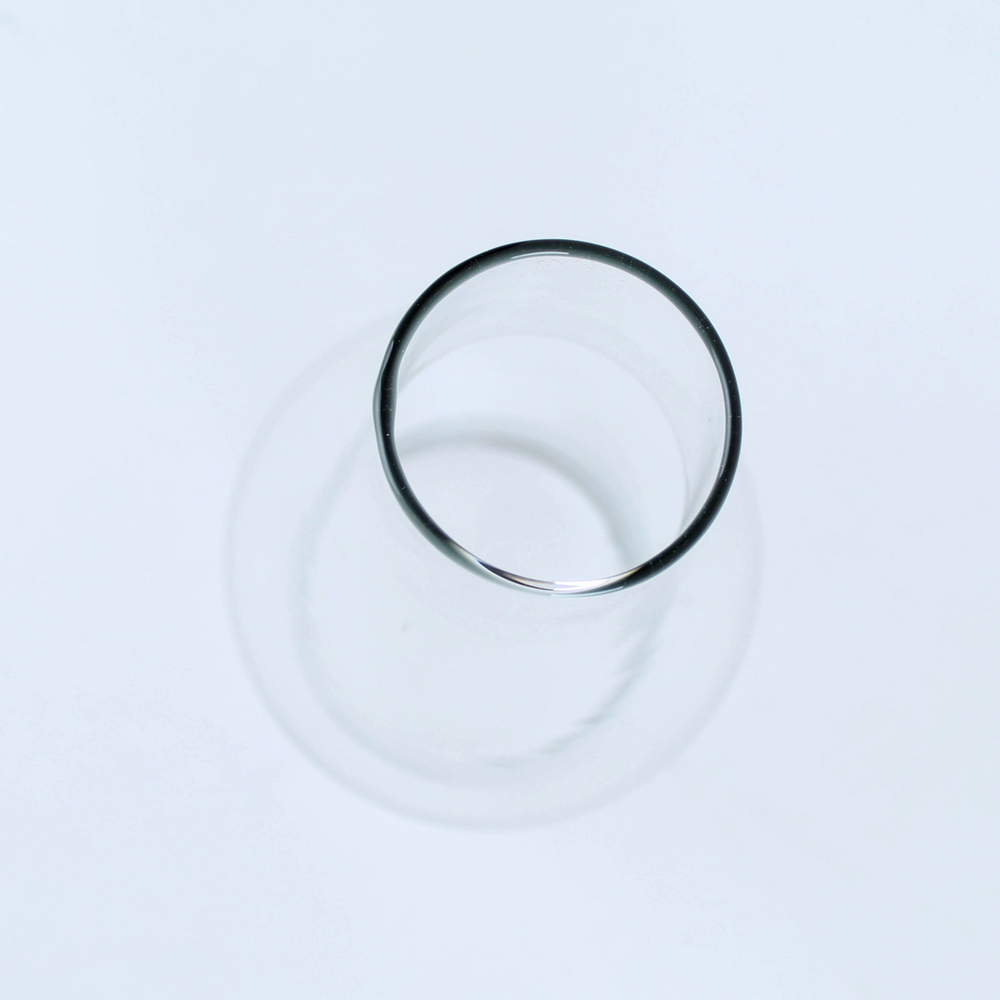 Clear cylindrical glass chimney with smooth rim designed for flame protection and light diffusion in home improvement projects