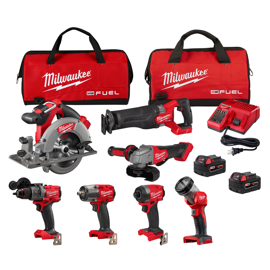 Set of red and black cordless power tools with batteries, charger, and carrying bags for professional home improvement tasks