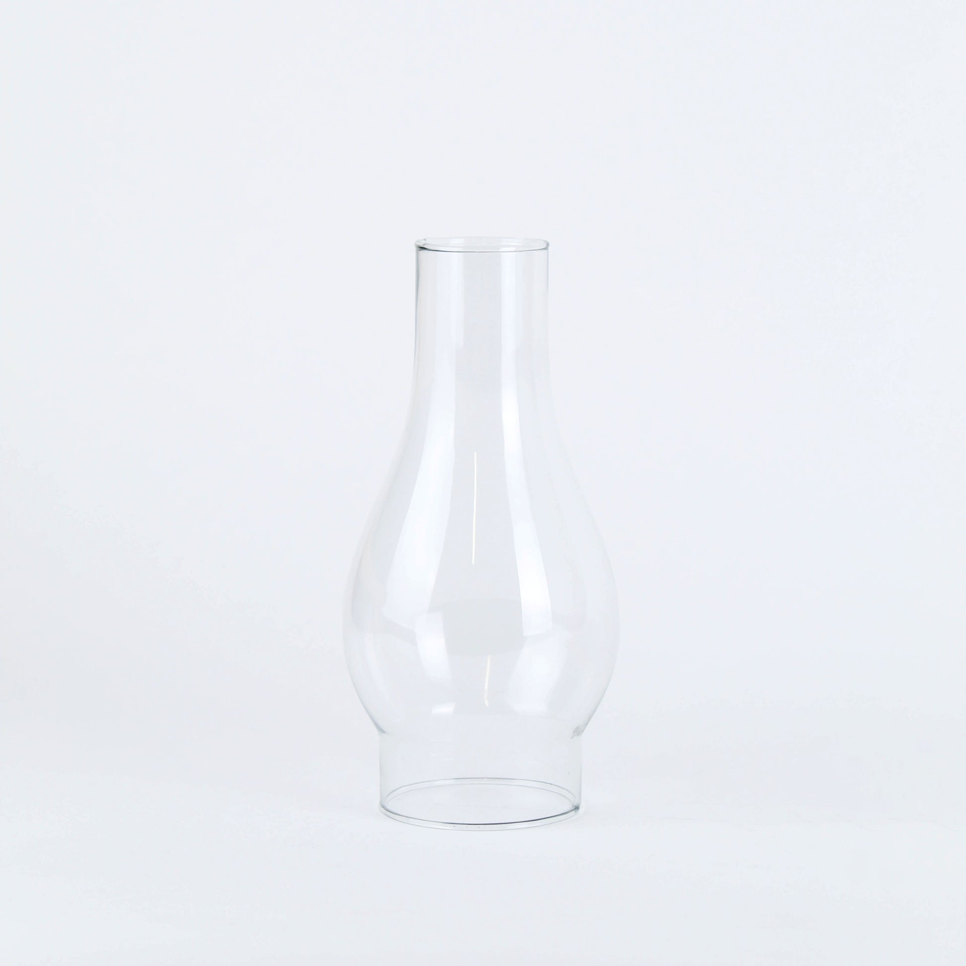 Clear Westinghouse glass lamp chimney with classic curved design for flame protection and enhanced light diffusion in home improvement