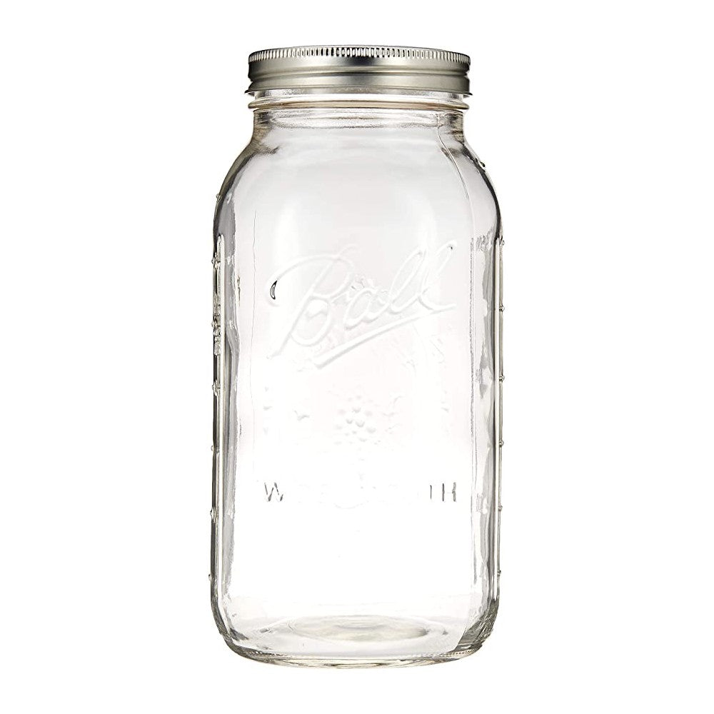 Clear wide mouth mason jar with metal screw-on lid for home canning and preservation tasks