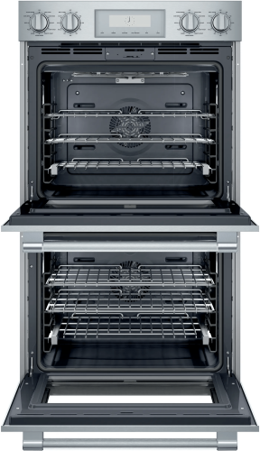 Opened stainless steel professional double wall oven with multiple racks, part of Thermador kitchen appliances collection