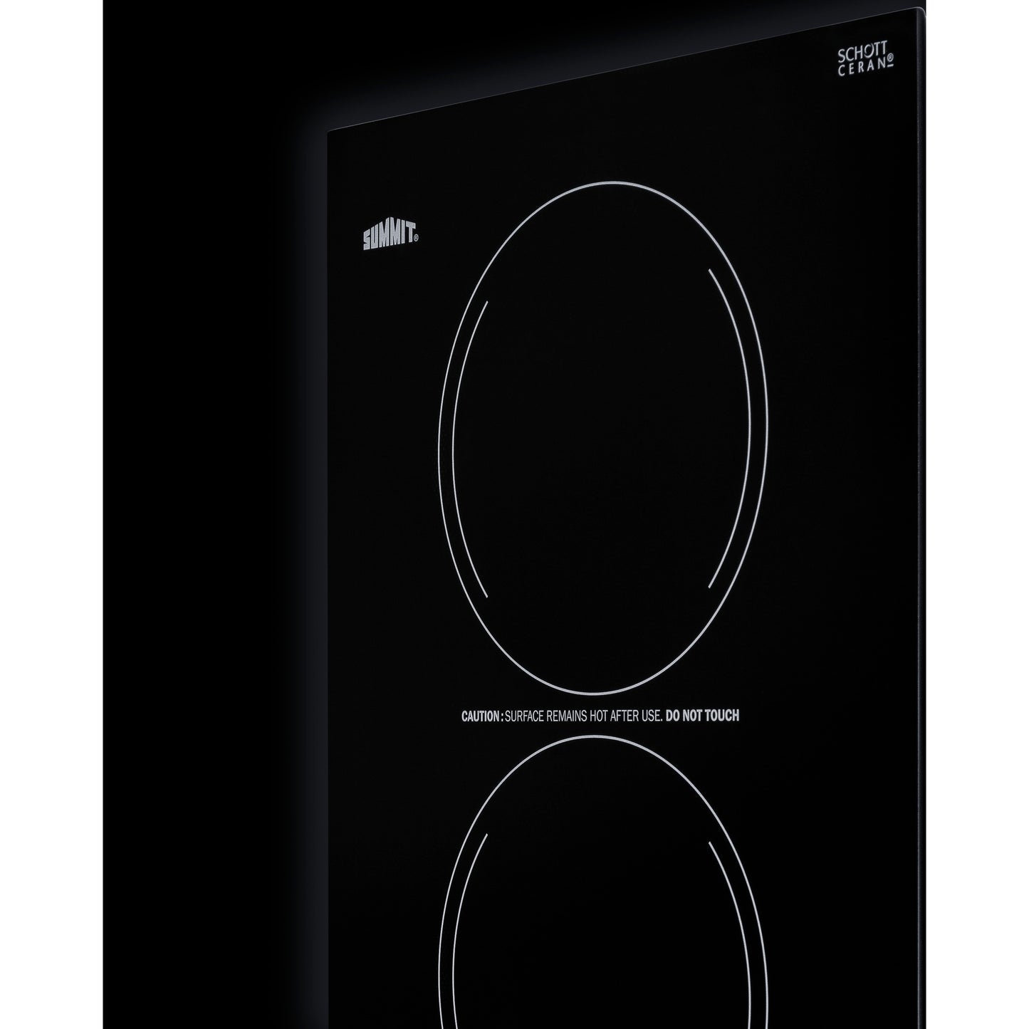 Black glass radiant cooktop with two circular burners and visible warning text for safe home improvement use