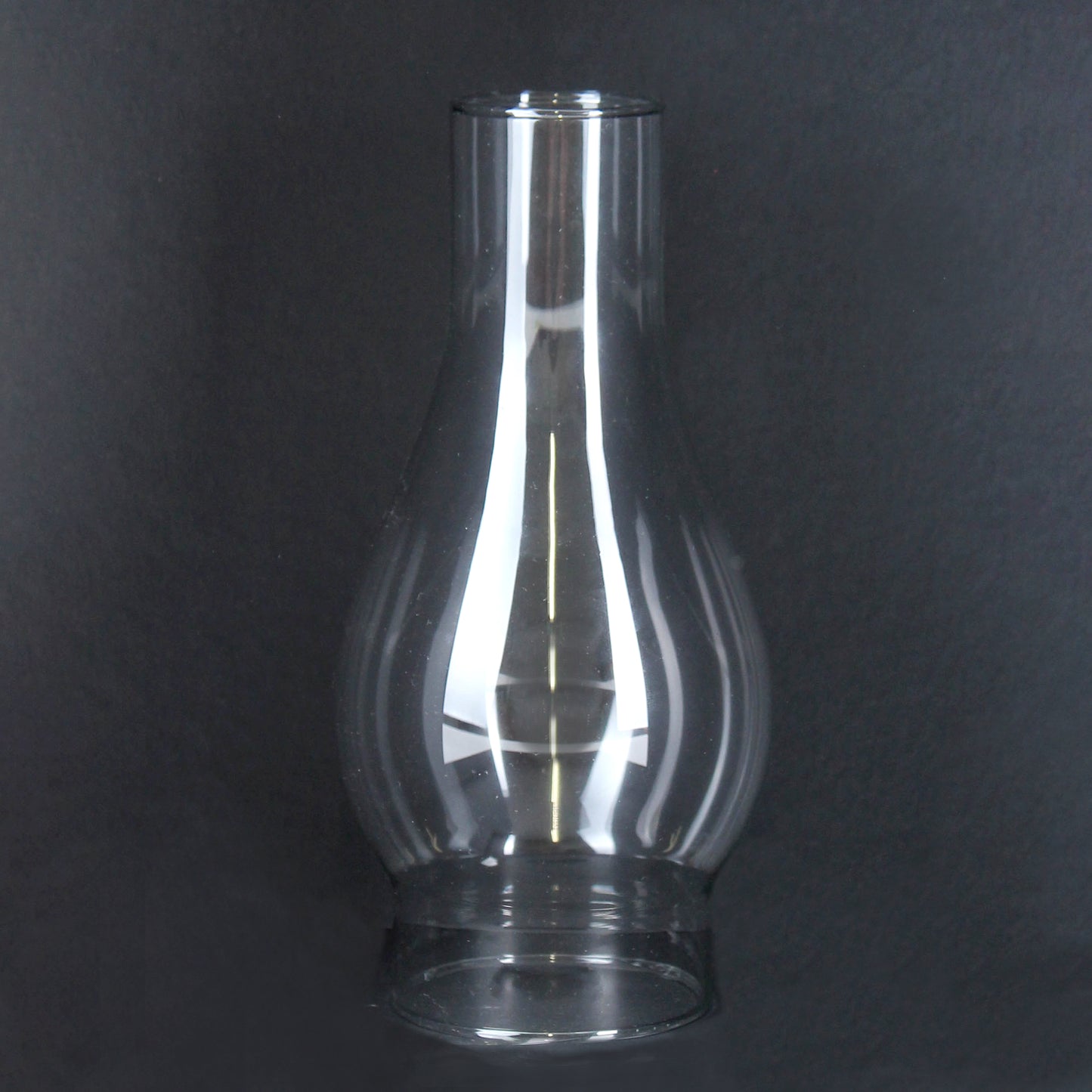 Transparent glass lamp chimney with classic bulbous shape for flame protection and light diffusion in home improvement projects