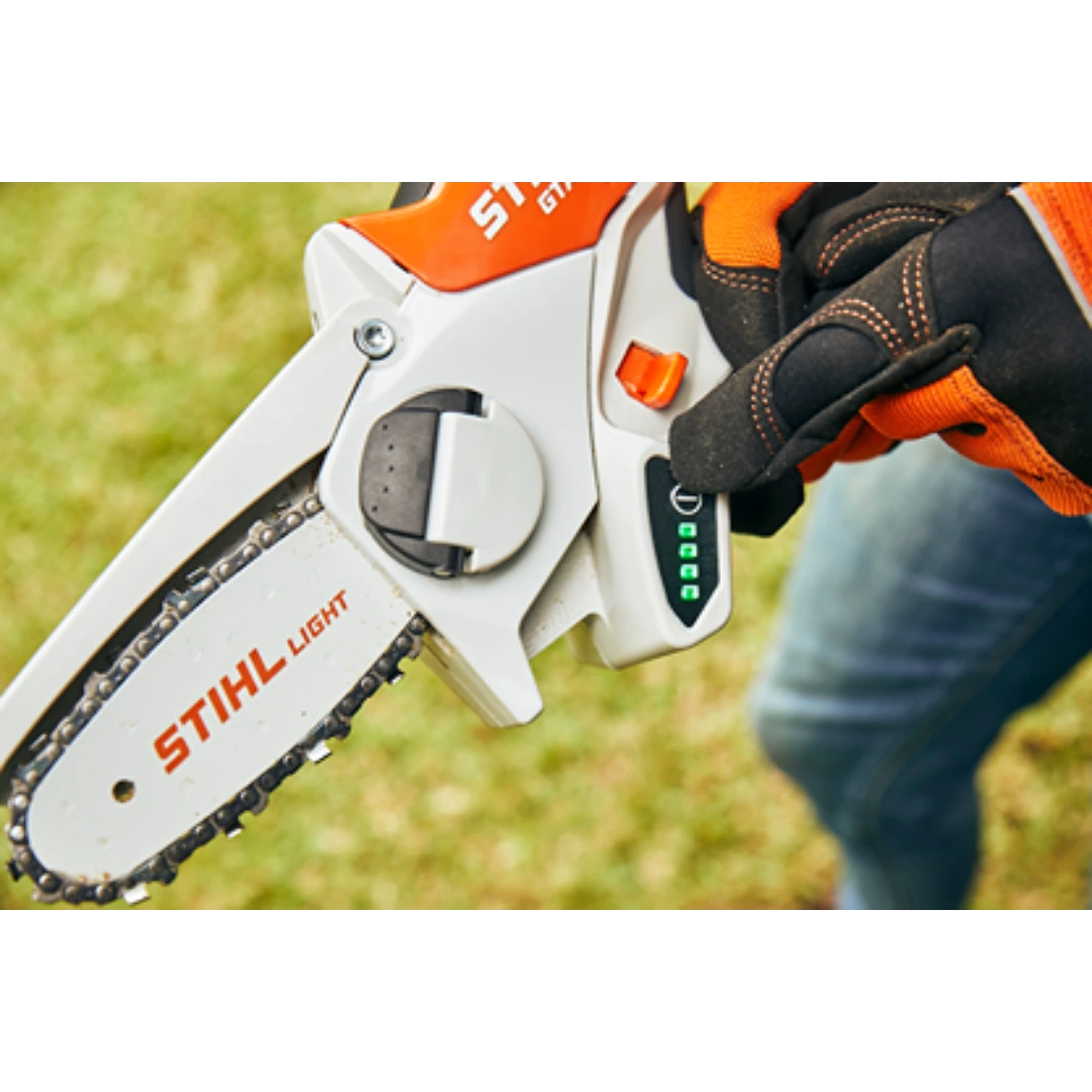 Handheld battery-powered garden pruner with orange and white casing and LED battery indicator for home improvement tasks