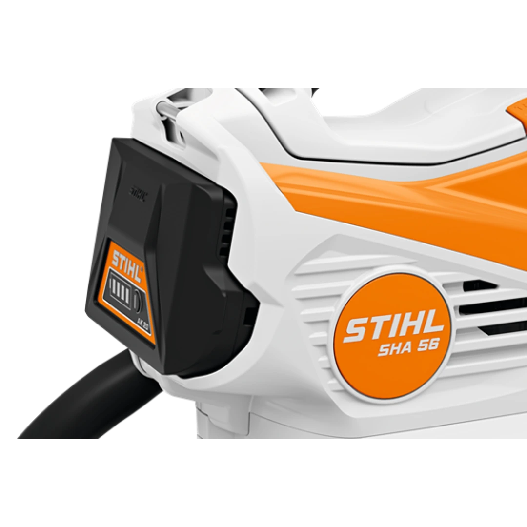 Close-up of the white and orange battery slot area on a STIHL SHA 56 outdoor shredder vacuum tool