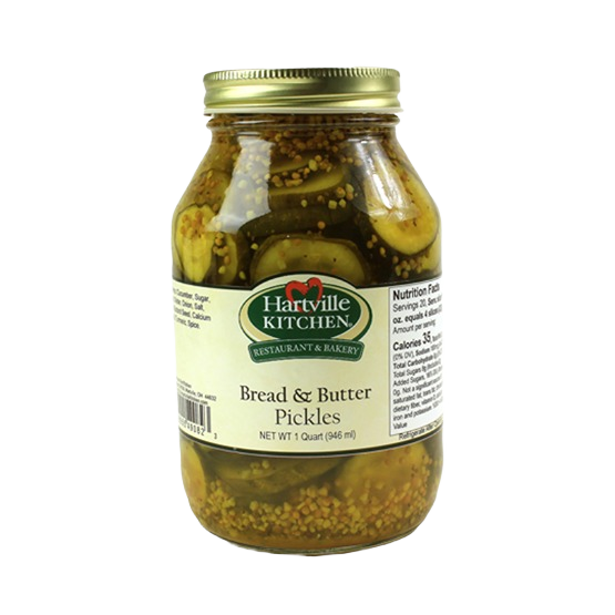 Glass jar of Hartville Kitchen Bread & Butter Pickles with yellow mustard seeds in preserved goods and food collection