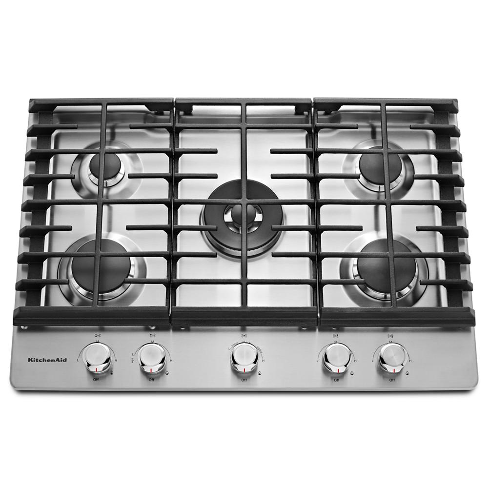 Stainless steel cooktop featuring five burners with black cast iron grates and control knobs for home improvement use