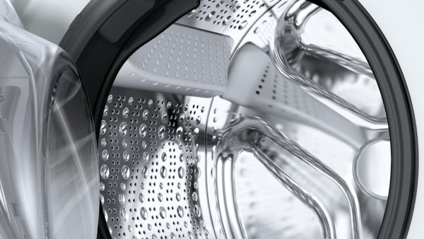 Close-up view of the polished stainless steel drum inside a compact Bosch washer from the Washers collection