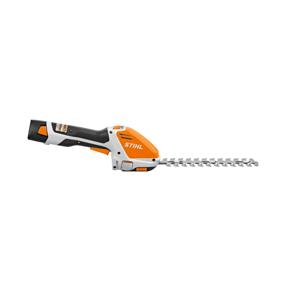 Compact orange and black cordless handheld hedge trimmer with battery and charger for home improvement tasks