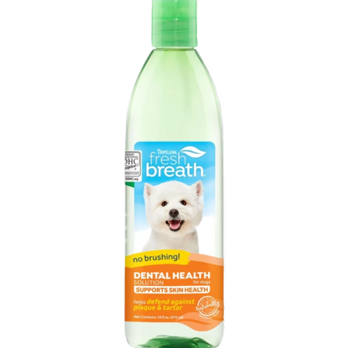 Green-capped bottle of dog dental and skin health water additive featuring a white dog on the label