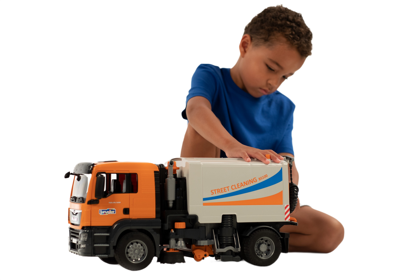 Child playing with detailed orange and white MAN TGS street sweeper toy in Bruder Toys and Vehicles collections
