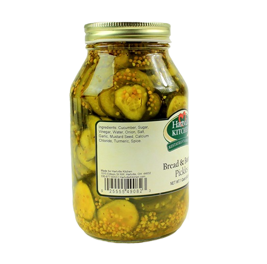Glass jar of sliced pickles with mustard seeds and spices from Hartville Kitchen preserved goods and food & beverage collections