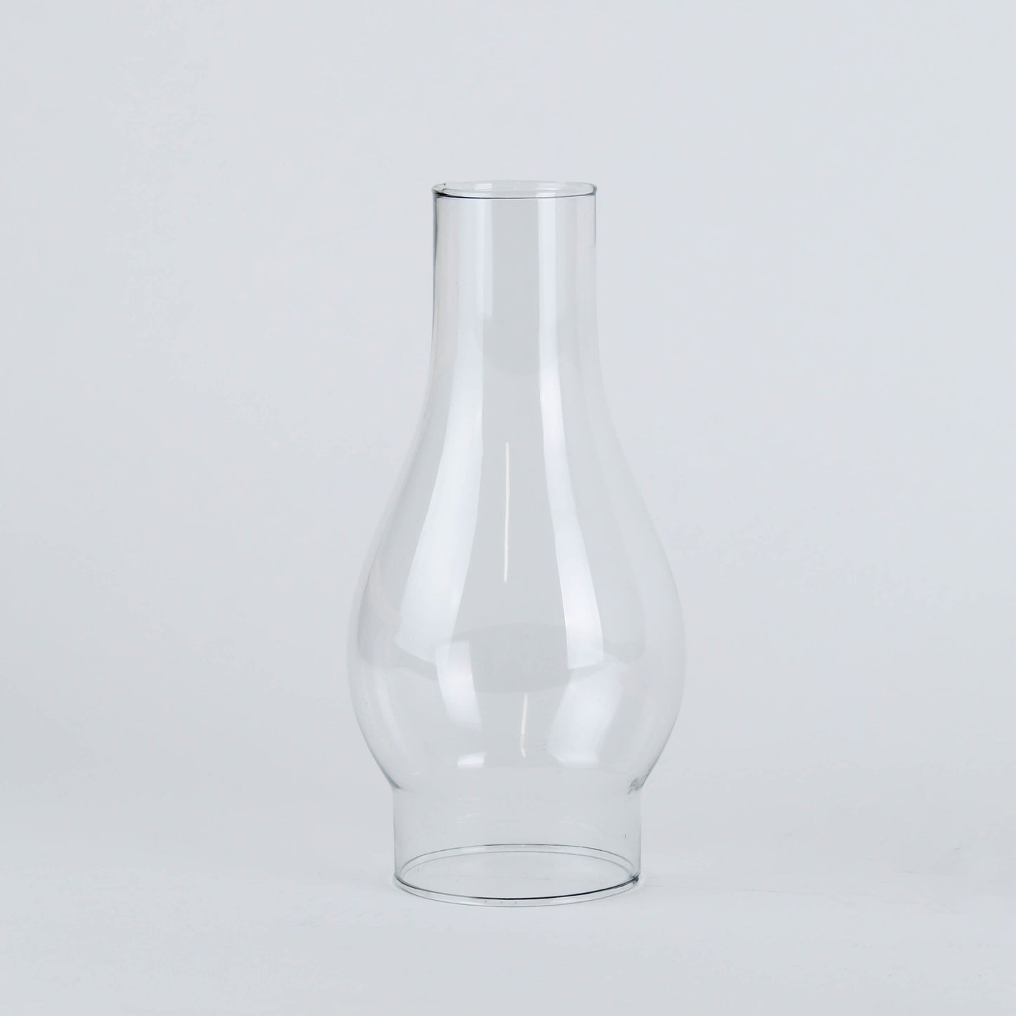 Clear glass lamp chimney with curved shape designed for flame protection and enhanced light diffusion in home improvement projects