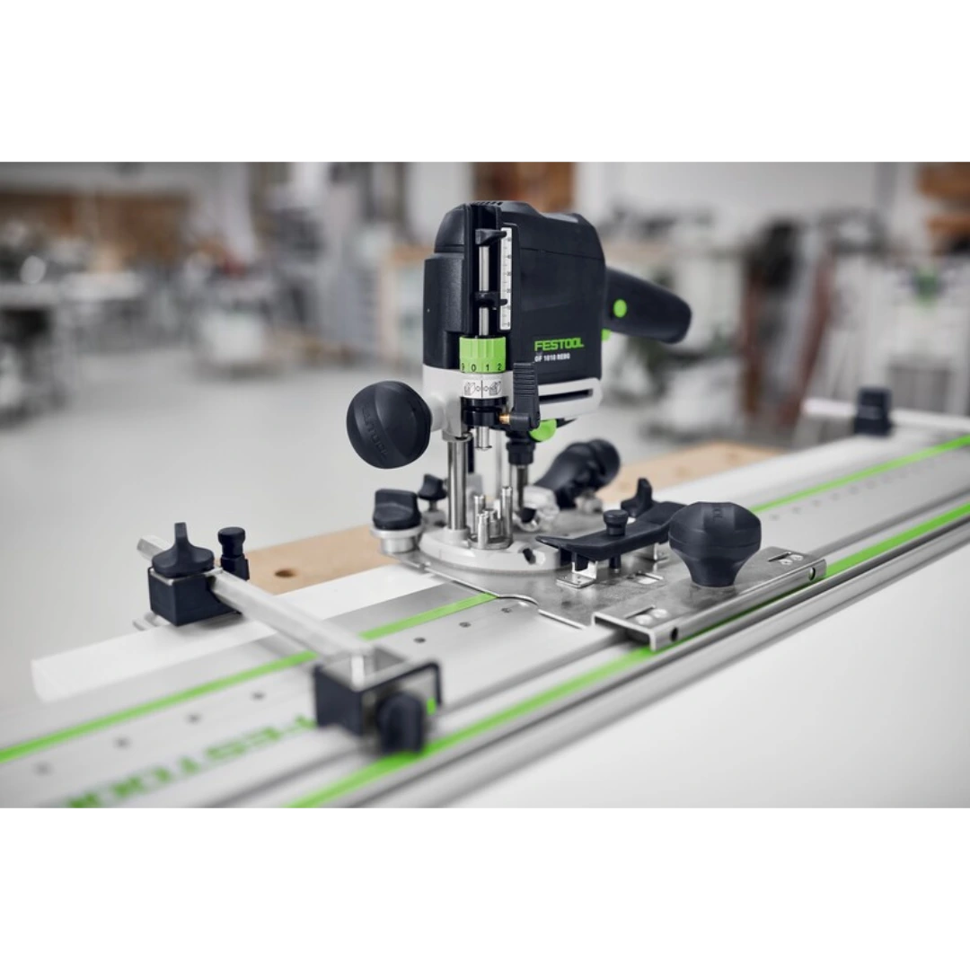 Compact Festool drilling guide tool mounted on wood panel with adjustable stops for woodworking tool accessories use