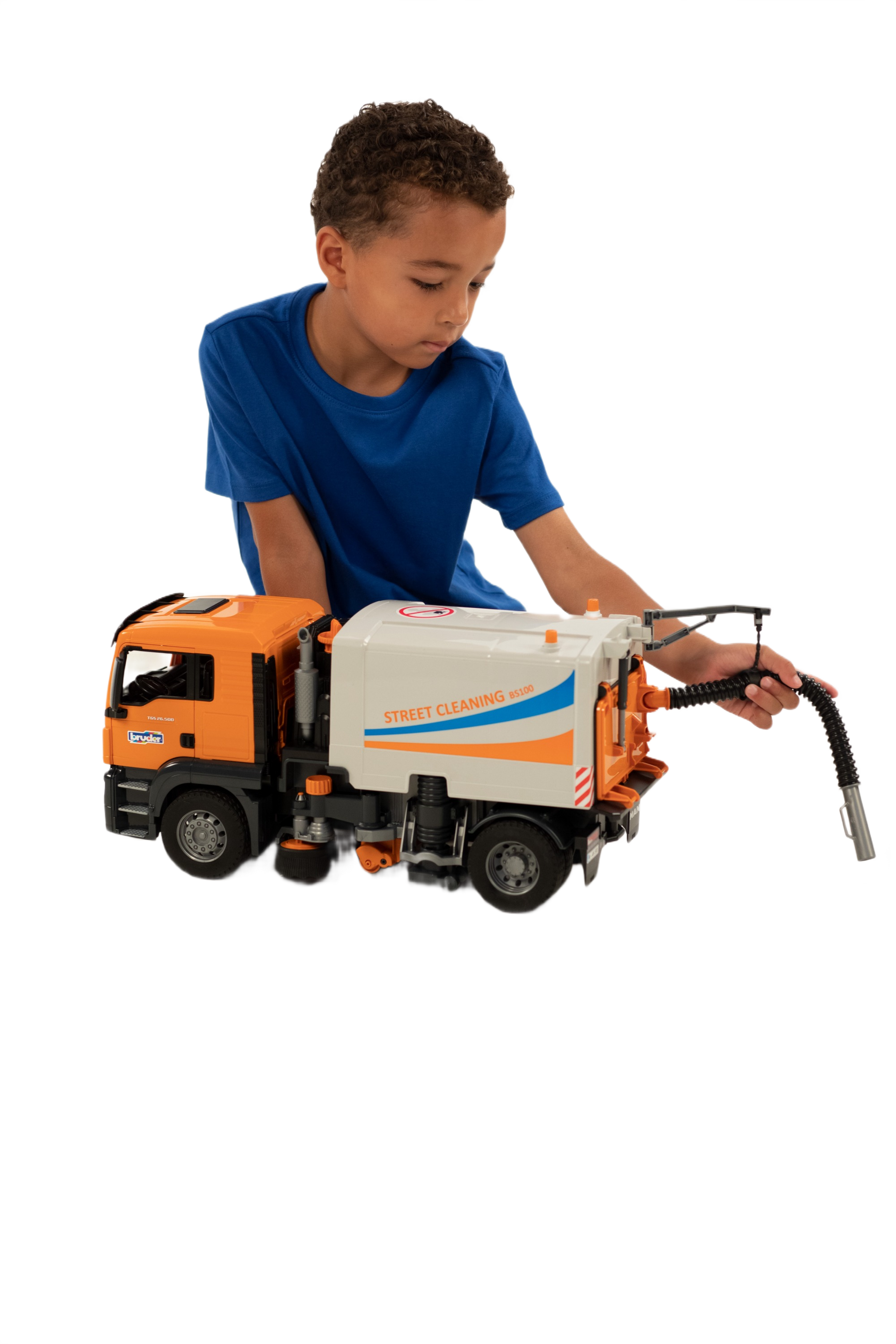 Child playing with orange and white street sweeper toy from Vehicles & Remote Controlled Toys and Bruder Toys collections