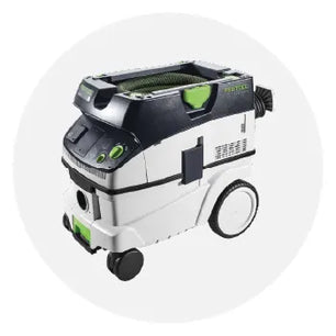 Compact dust extractor with white and black housing, green accents, large rear wheels, and a hose attachment designed for efficient dust collection in home improvement tasks.
