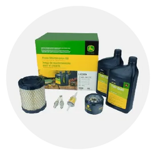 Green and yellow engine maintenance kit including air filter, fuel filter, spark plugs, oil filter, and two containers of SAE 10W-30 oil for home improvement tools.