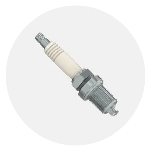 Single spark plug with metal threaded body and white ceramic insulator, commonly used in small engine maintenance and home improvement tools.
