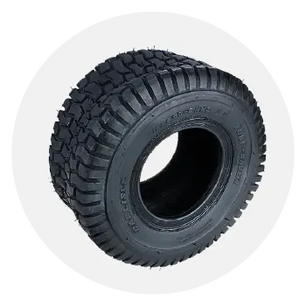 Wide black rubber tire with deep, aggressive tread pattern designed for outdoor equipment or lawn tractors on a white background.