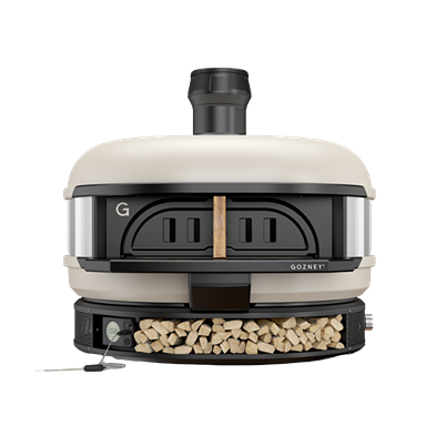 Cream-colored outdoor wood-fired pizza dome oven with integrated wood storage for grilling and lawn use