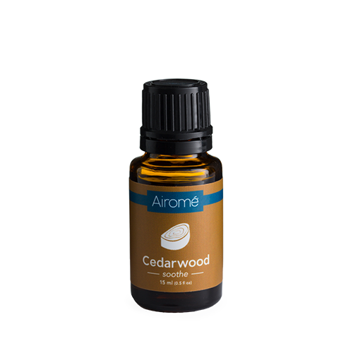 Amber glass bottle of cedarwood essential oil with black cap for home decor and relaxation purposes