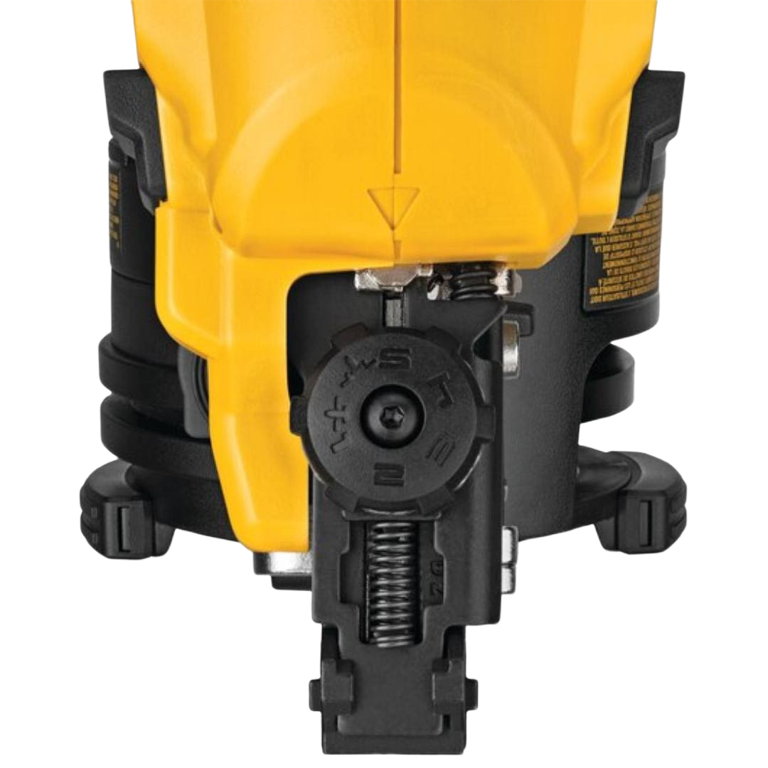 Close-up of adjustment dial and spring mechanism on yellow and black cordless roofing nailer for home improvement projects