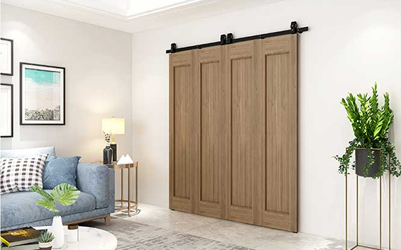 Black flat track sliding hardware with polymer wheels installed on wooden bifold barn doors in modern living room