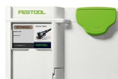 Close-up of white Festool storage box with green latch and custom label for workshop tool organization and jobsite storage
