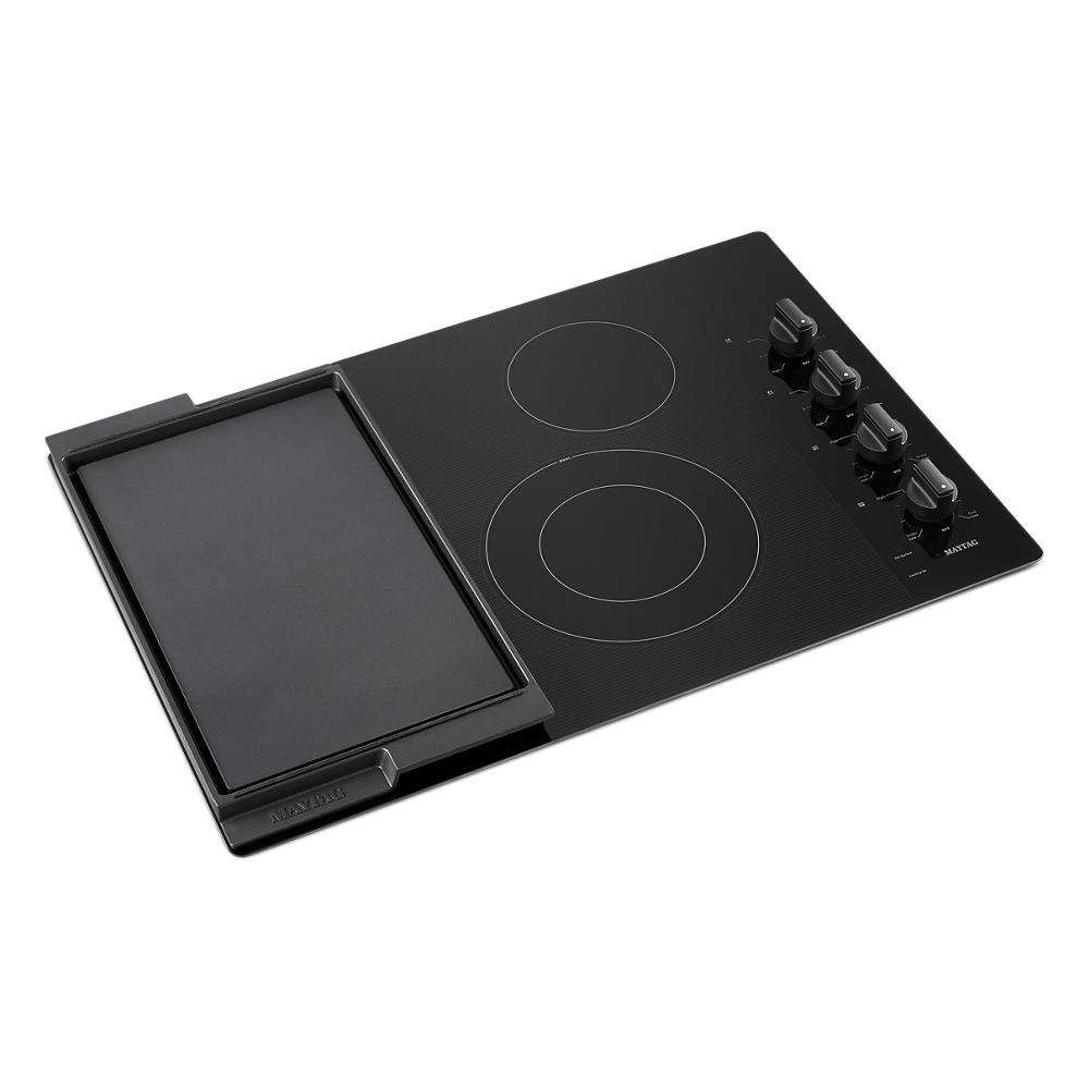 30-inch black electric cooktop with dual circular elements, reversible grill and griddle, and four control knobs from cooktops collection