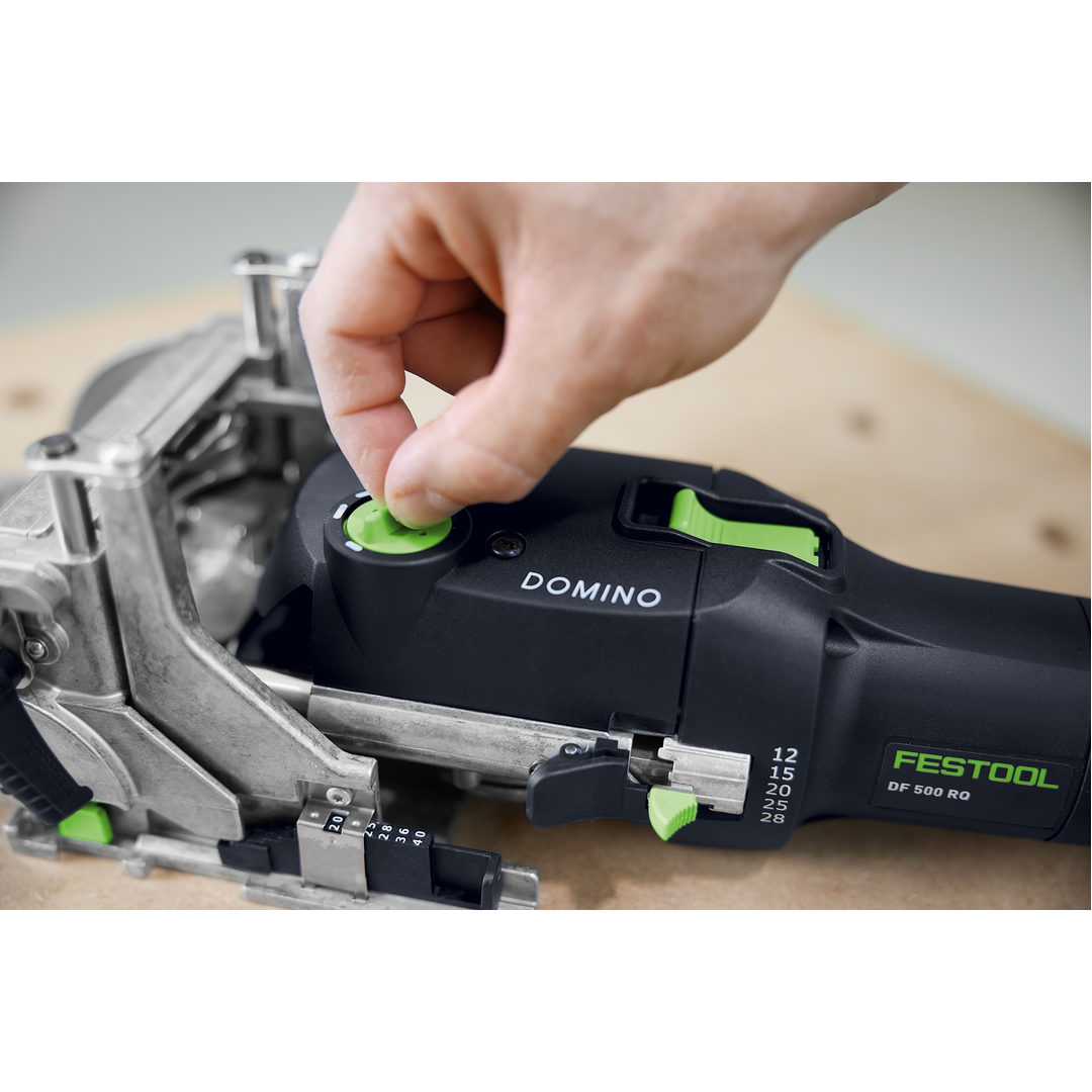 Close-up of a hand adjusting the depth setting on a Festool DOMINO joiner, a precision power tool for woodworking and home improvement projects.