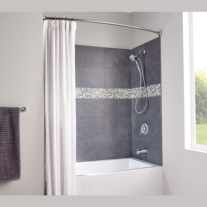 Chrome curved shower rod installed above white bathtub with dark gray tiled wall and white shower curtain for home improvement