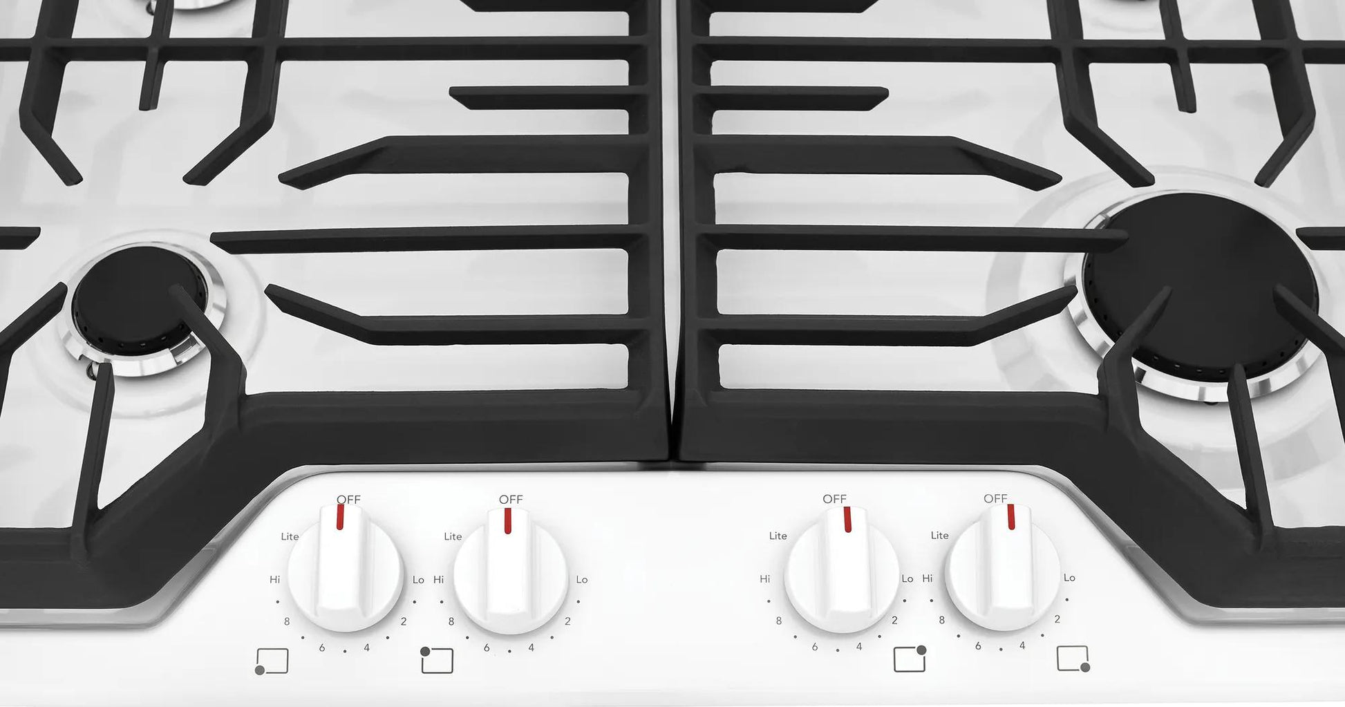 White gas cooktop with four burners, continuous edge-to-edge grates, and control knobs in cooktops and kitchenware collection