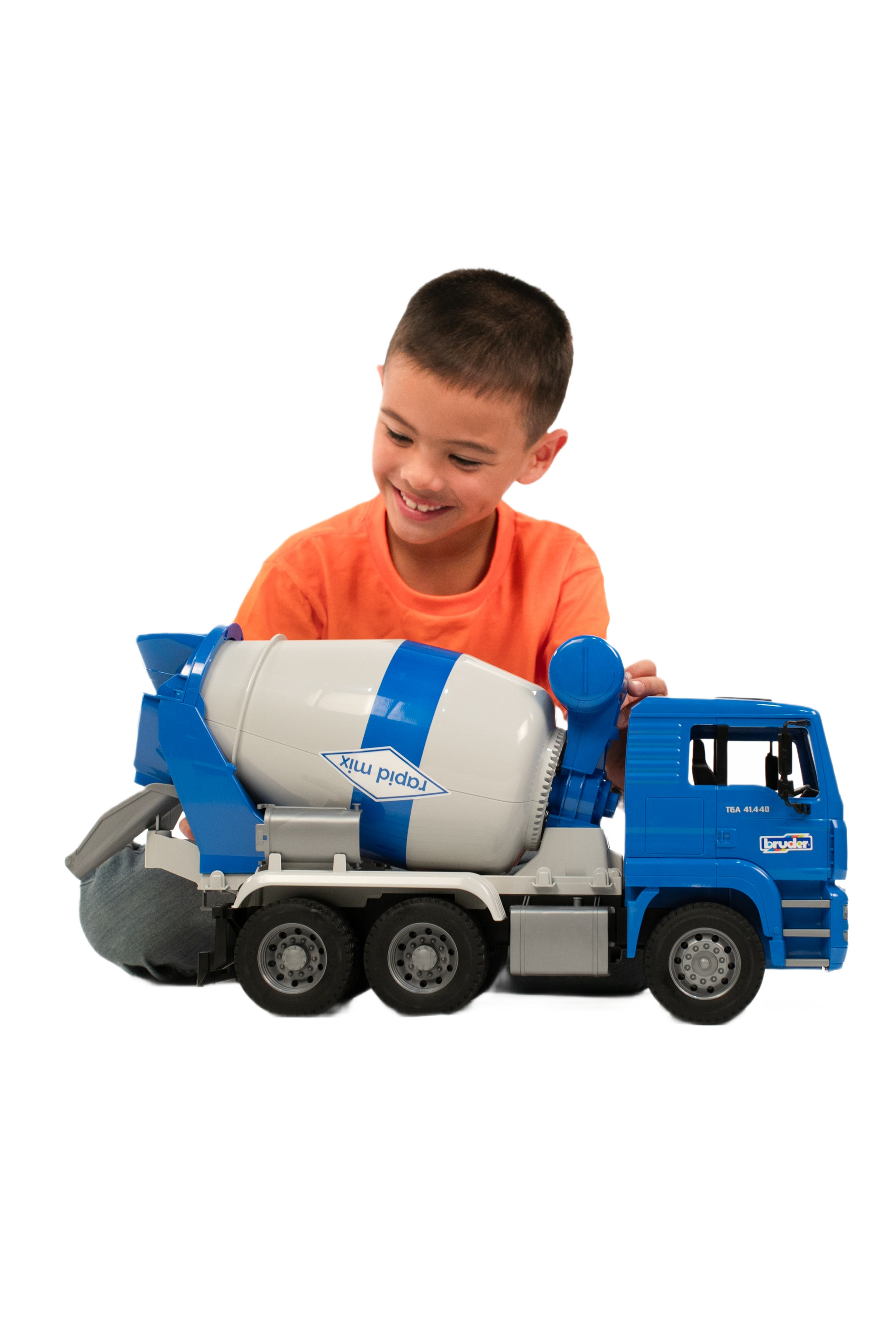 Young boy playing with a detailed blue and white Bruder MAN TGA Cement Mixer toy from Vehicles & Remote Controlled Toys collection