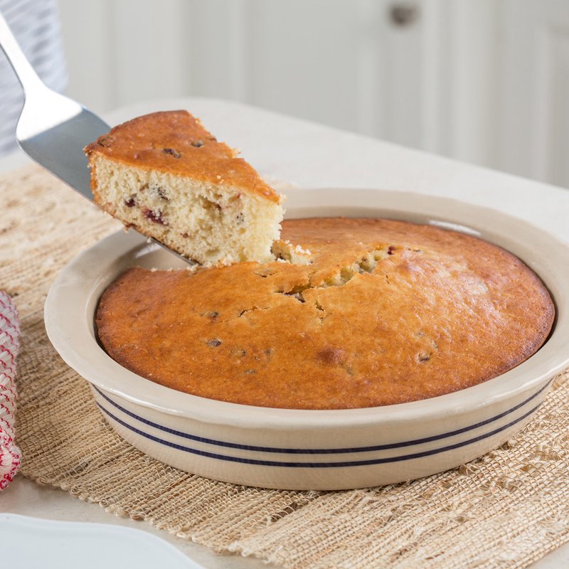 Hand-thrown stoneware pie pan with blue stripes holding freshly baked cake, part of kitchenware and bakeware collections