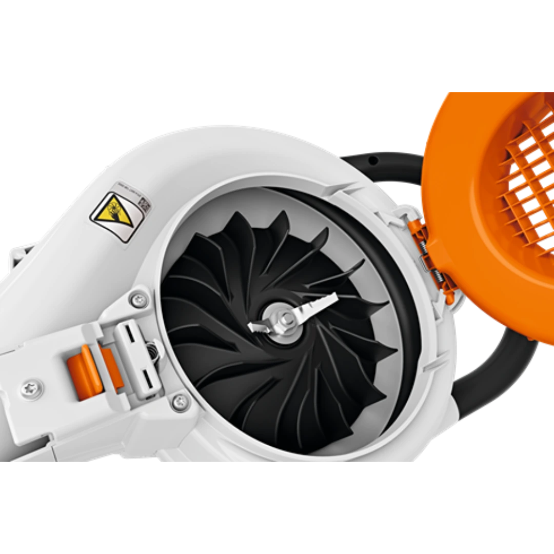 Close-up of the black shredding blade inside a white and orange battery-powered garden shredder vacuum tool