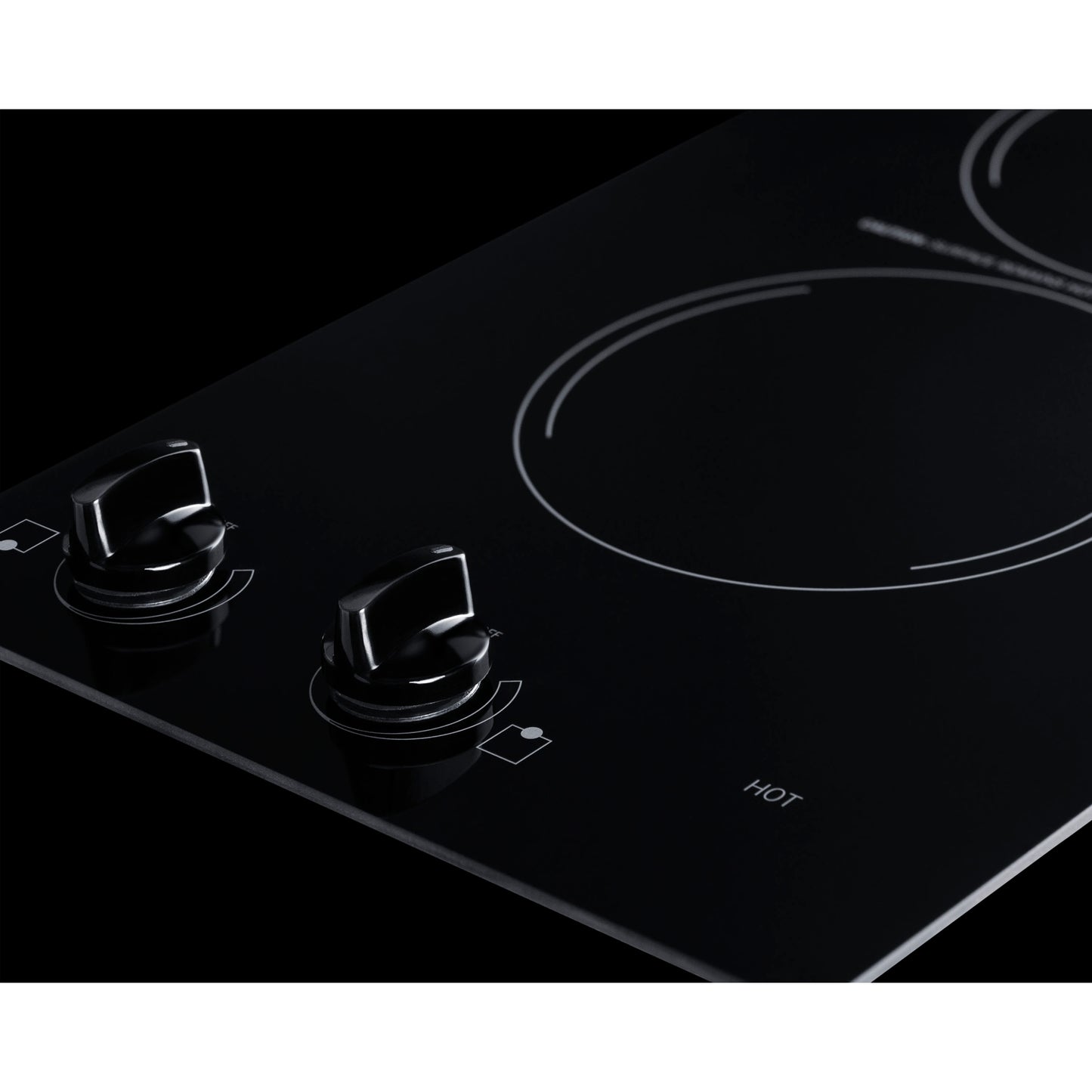 Black glass radiant cooktop with two circular burners and dual control knobs for home improvement kitchen use
