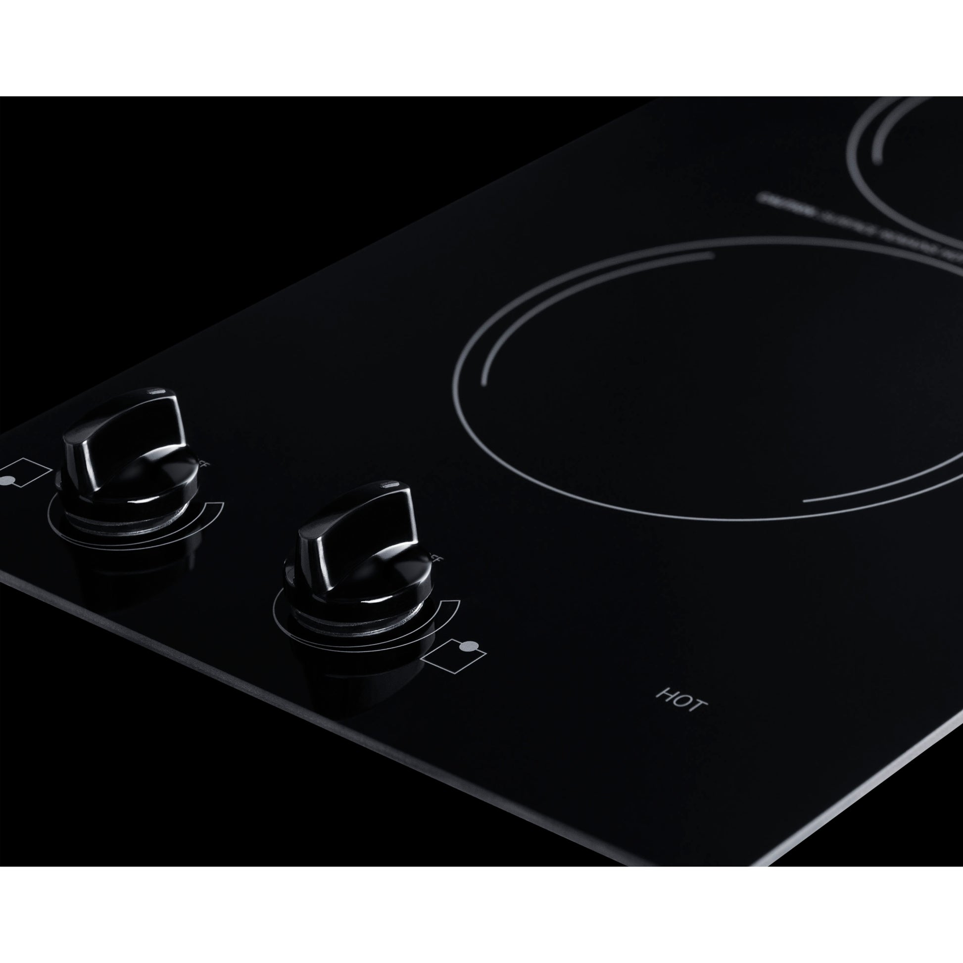 Black glass radiant cooktop with two circular burners and dual control knobs for home improvement kitchen use