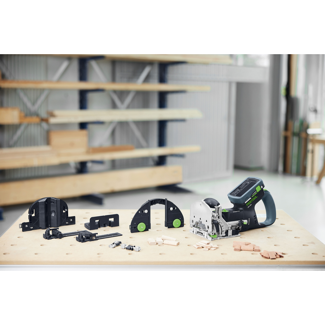 Festool 578544 DOMINO Joiner DF 500 RQ-Set displayed on a workbench with accessories, highlighting precise joinery tools for woodworking and power tool collections.