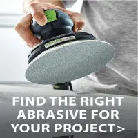 Close-up of a person holding a handheld power sander with a circular abrasive pad, preparing to smooth a wooden surface for a home improvement task.